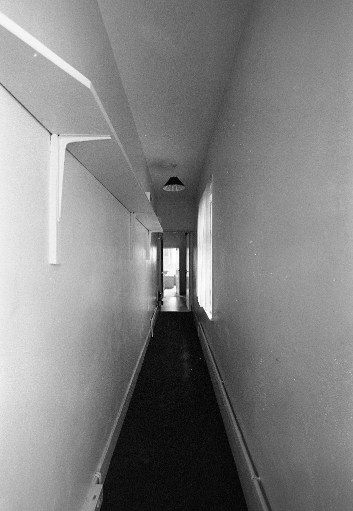 Black and white photo pof interior of old building shot on expired HP5 black and white film by Jason Avery