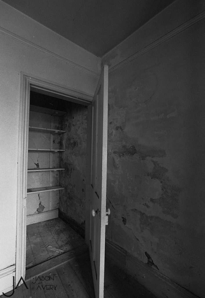 Black and white photo pof interior of old building shot on expired HP5 black and white film by Jason Avery
