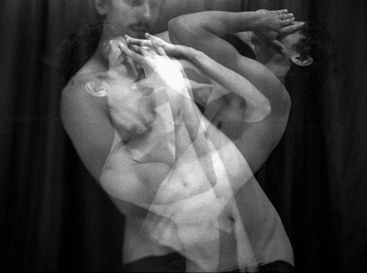 Multiple-exposure black and white photograph showing entwined bodies for the project “La boutique de l’âme” using Mamiya M645 and Ilford HP5+
