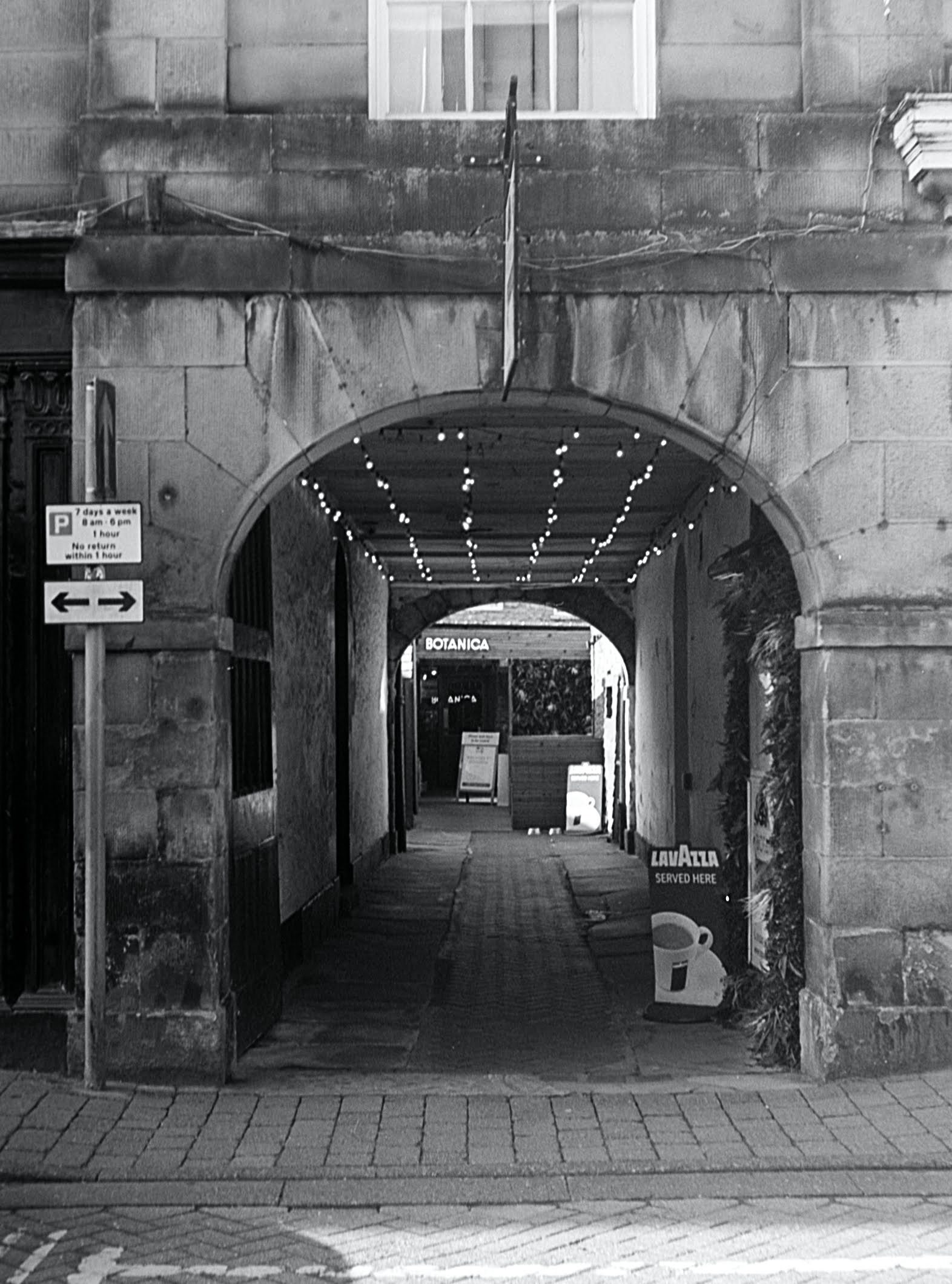 @Gravmadboris Photo 1 - Back Alley in Kirkby Lonsdale Photo 2 - The Face of Wigan Both shot with my Balda Baldax 4.5x6 (half frame medium format) on Ilford HP5 #halfframe #ilfordphoto #fridayfavourites