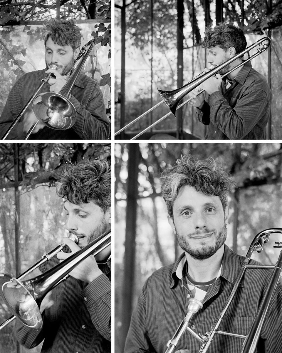 Friday Favourites #lycricallyspeaking. A black and white portrait of a man with a beard playing an instrument. 