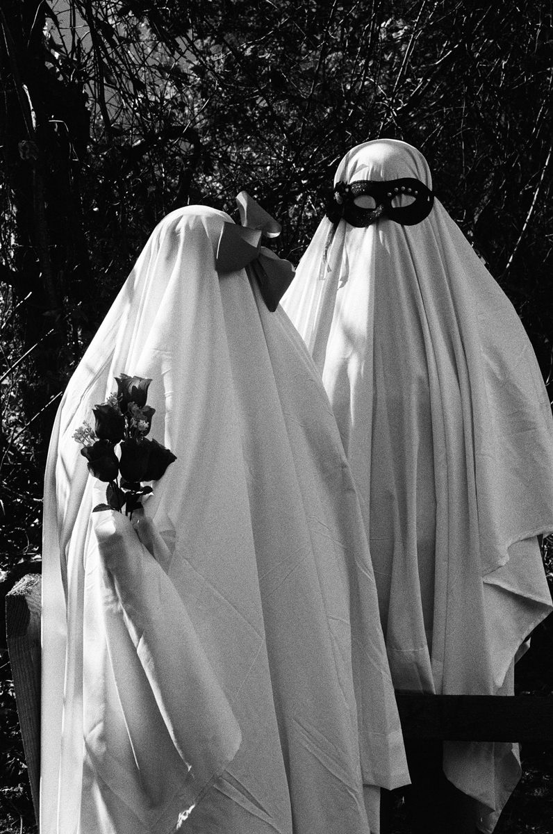 Friday Favourites #spookyfilm. Black and white picture of two people dressed up as ghosts.