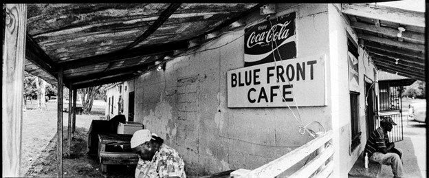 Larry Niehues. Panoramic black and white shot of a cafe.