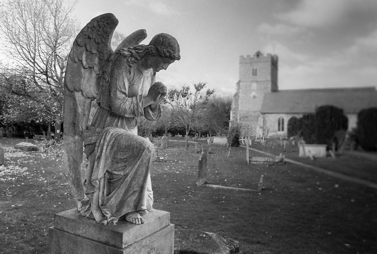 Friday Favourites #spookyfilm. Black and white angel statue in a cemetery.