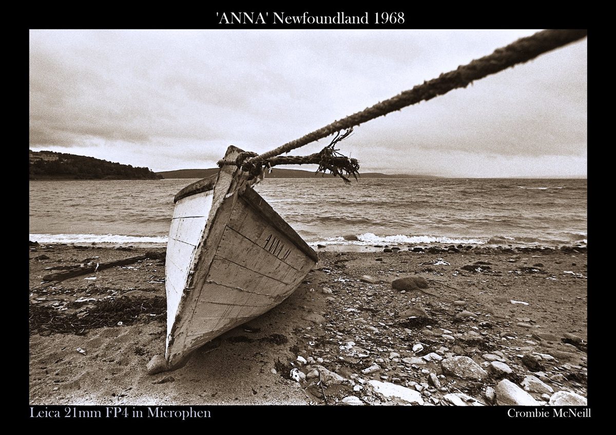 Crombie McNeill. Sepia image of a boat on the beach.