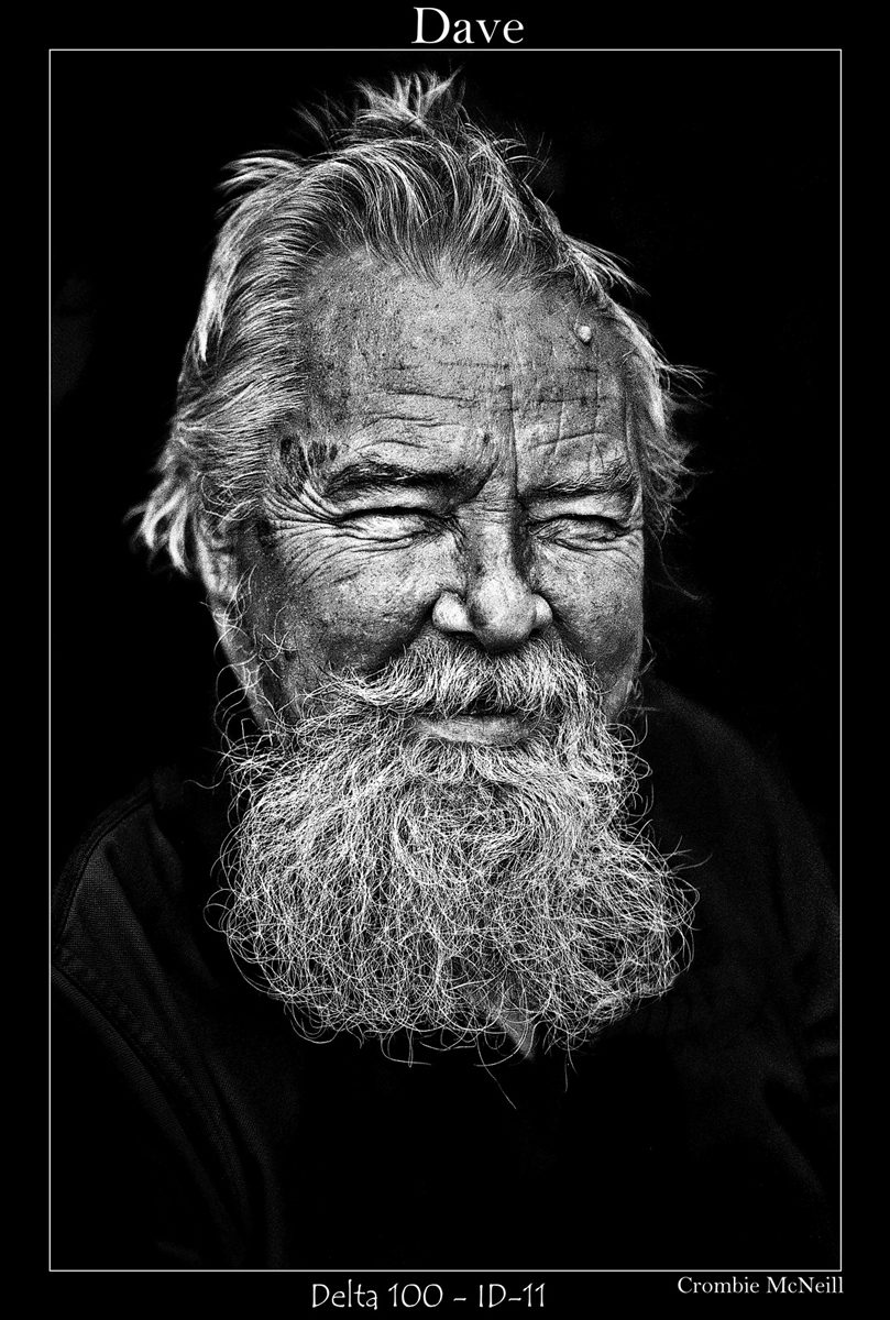 Crombie McNeill. Black and white portrait of a man with a big beard.