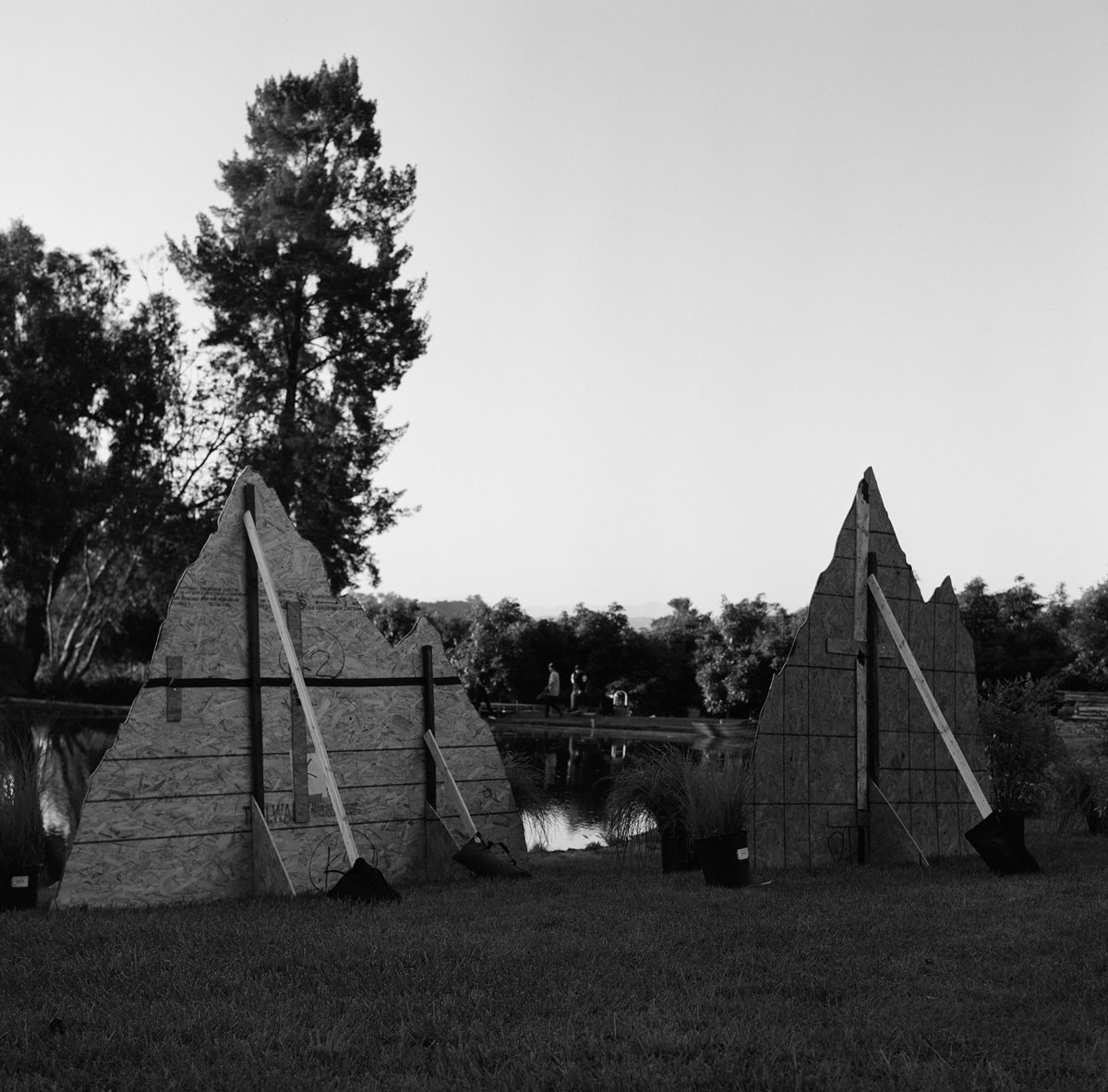 Hannah Baker. Black and white shot of a set that is located on a lake.