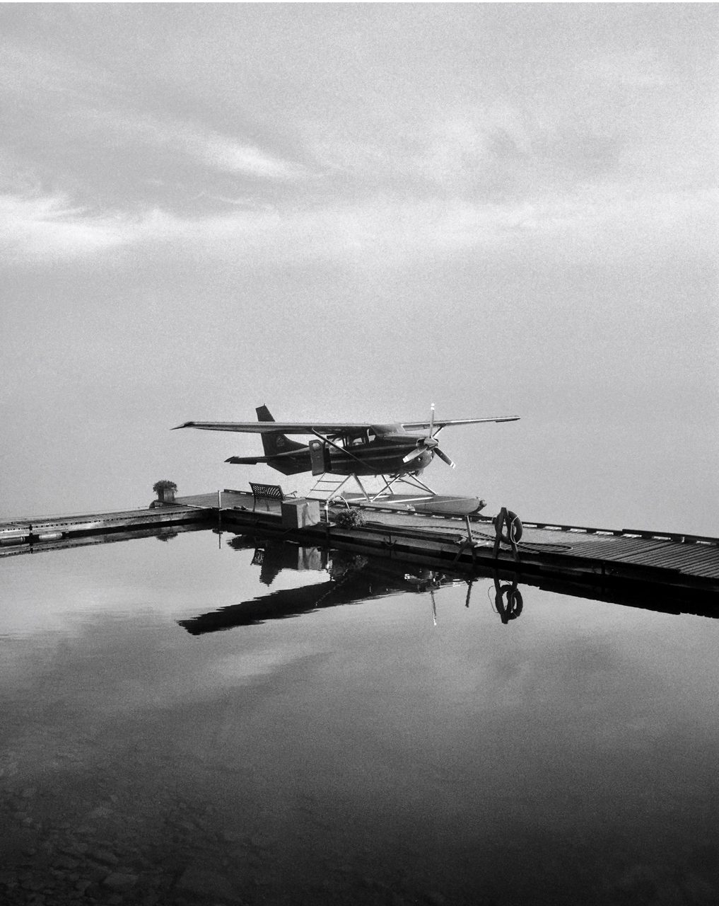 Friday Favourites. Black and white image of a plain landed surrounded by water.