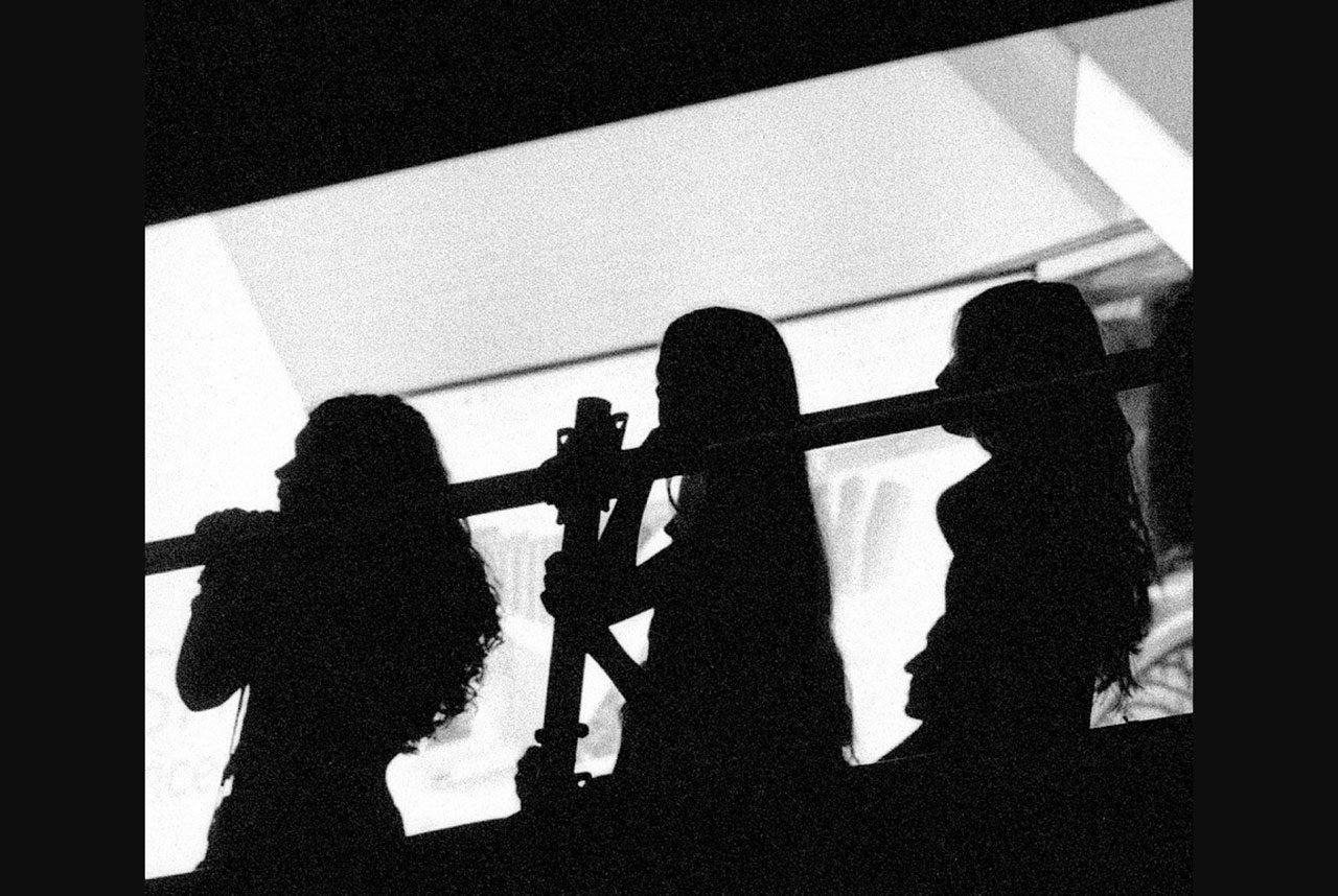 Julian Tanase. Black and white silhouette of a band