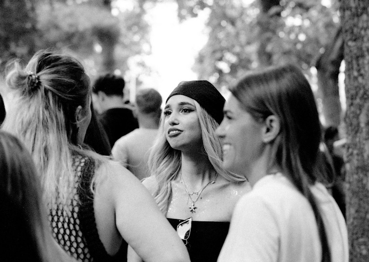 Julian Tanase. Black and white portrait of a few young girls talking