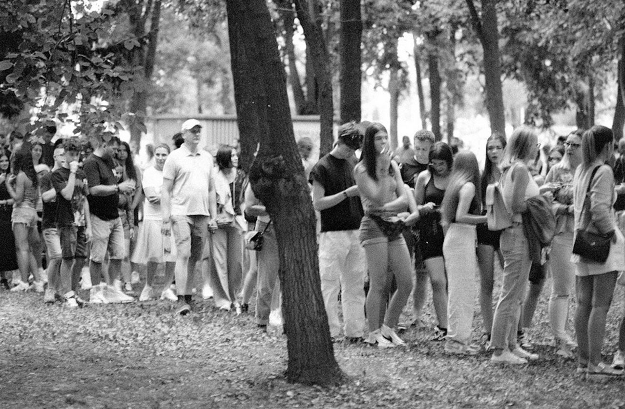 Julian Tanase. Black and white shot of people lined up