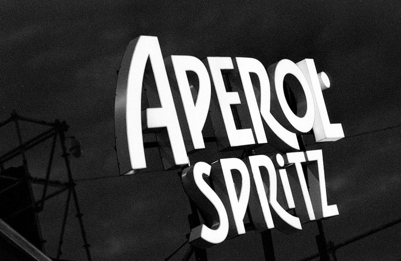 Julian Tanase. Black and white Aperol Spritz banner