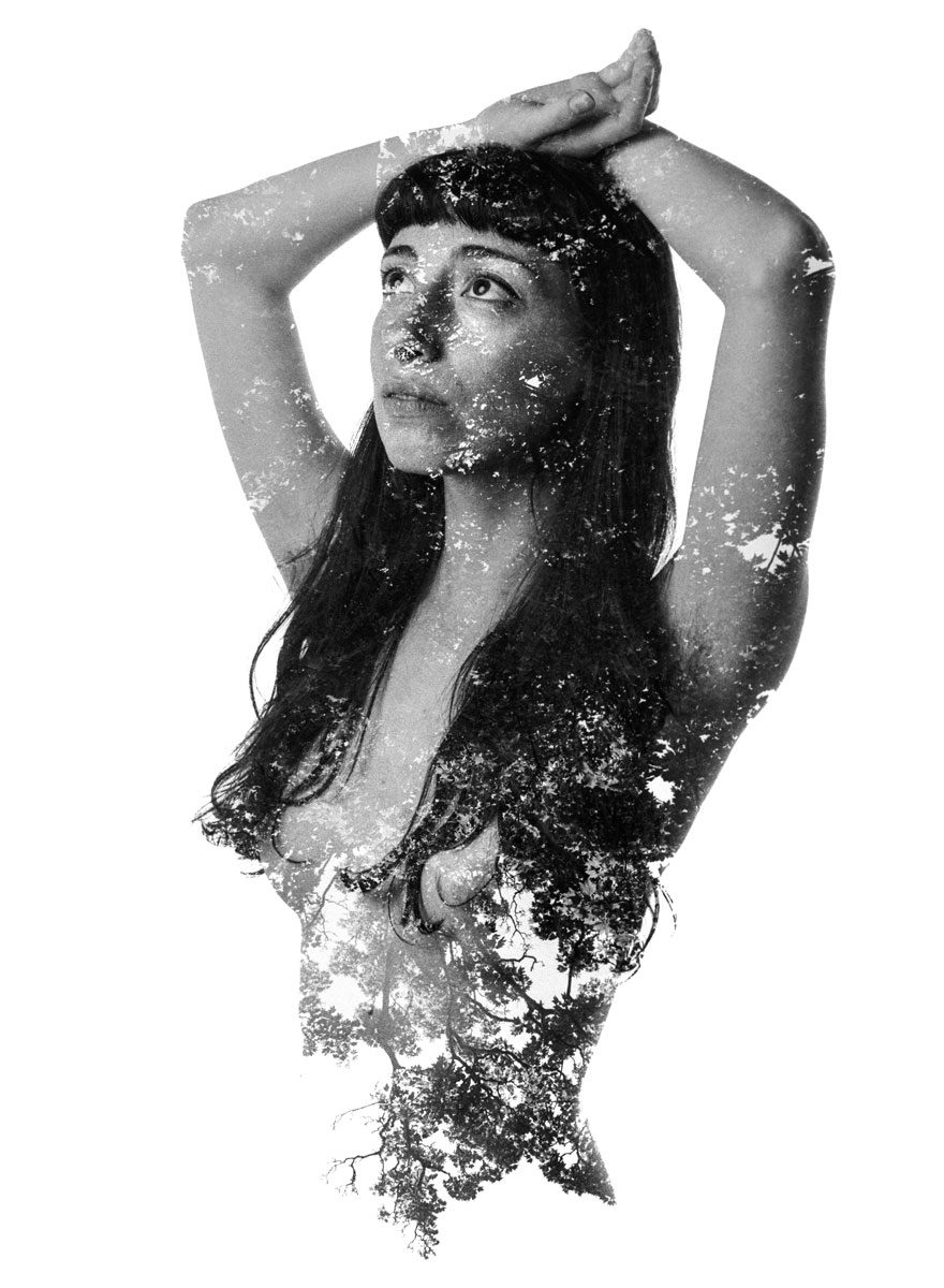 Ben Felton. Black and white double exposure of a lady naked with trees covering her