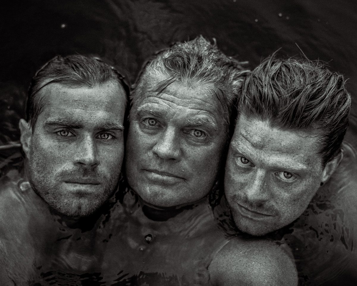 In Focus Jakob Stolz. Black and white shot of three men in water.