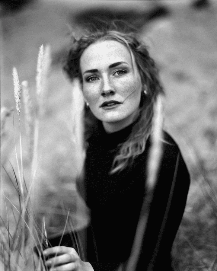 Friday Favourites. Black and white portrait of a woman in a field.