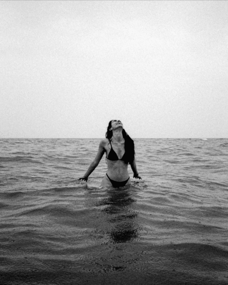 Friday Favourites. Black and white portrait of a woman on the beach in a bikini.