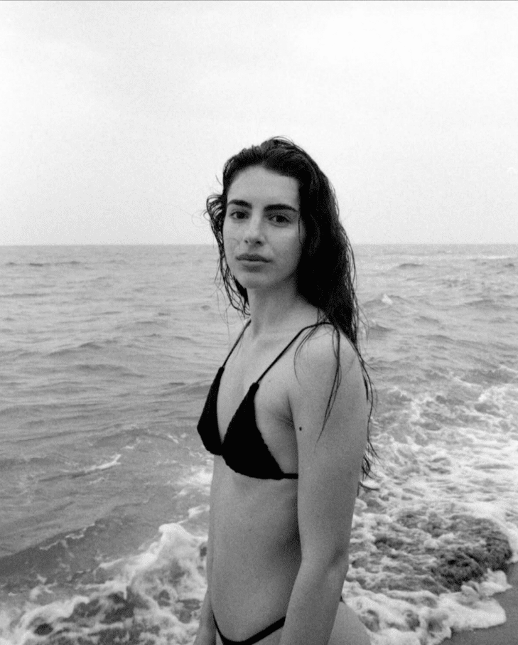 Friday Favourites. Black and white portrait of a woman on the beach in a bikini.