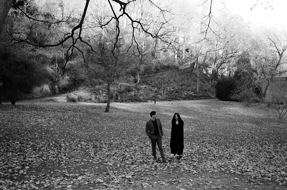 Friday Favourites #themefree. Black and white image of two people dressed in black stood in a field.