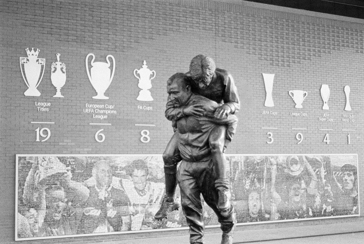 Behind The Film - Kieran Collings. Black and white shot of a football statue.