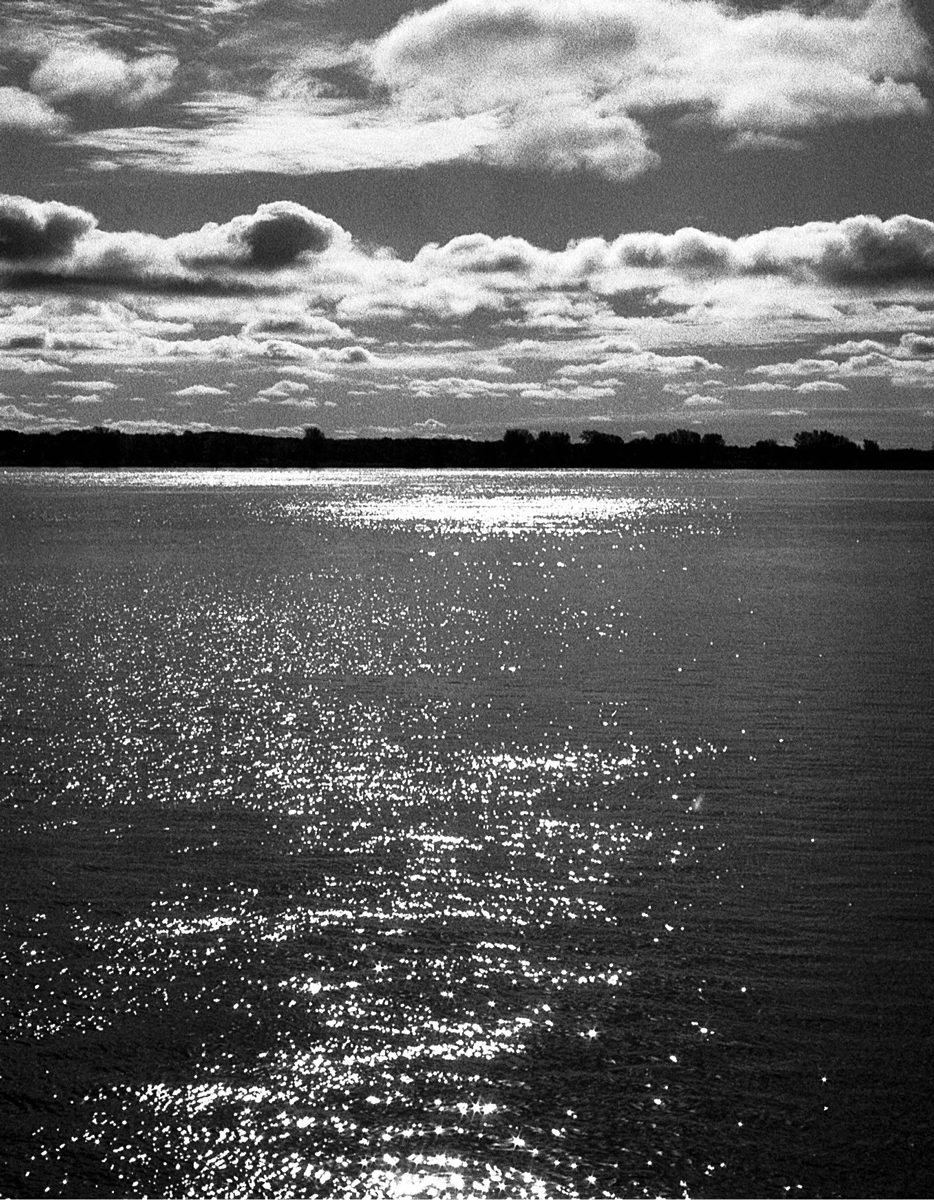 Friday Favourites #febonkentmere400. Black and white image of the sea sparkling.