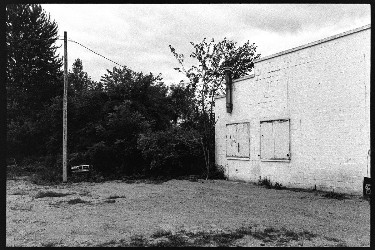 Black and white shot of a white building 