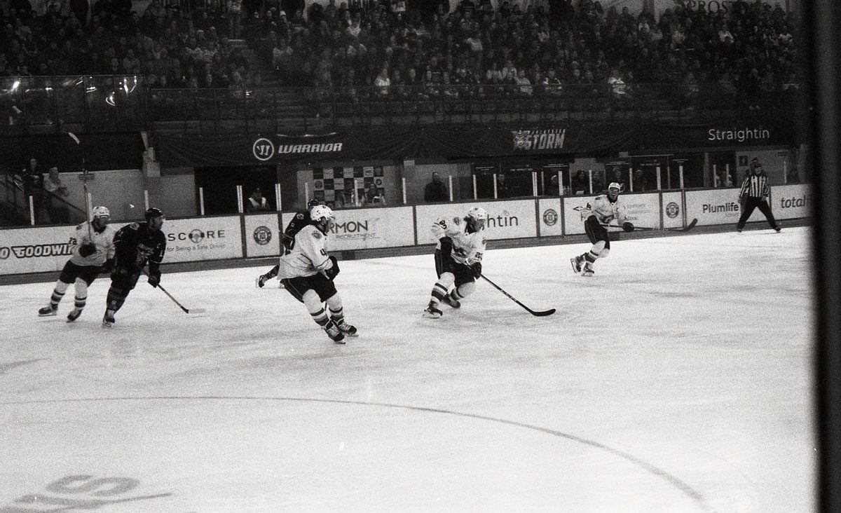 Behind The Film - Kieran Collings. Black and white picture of an ice hockey match.