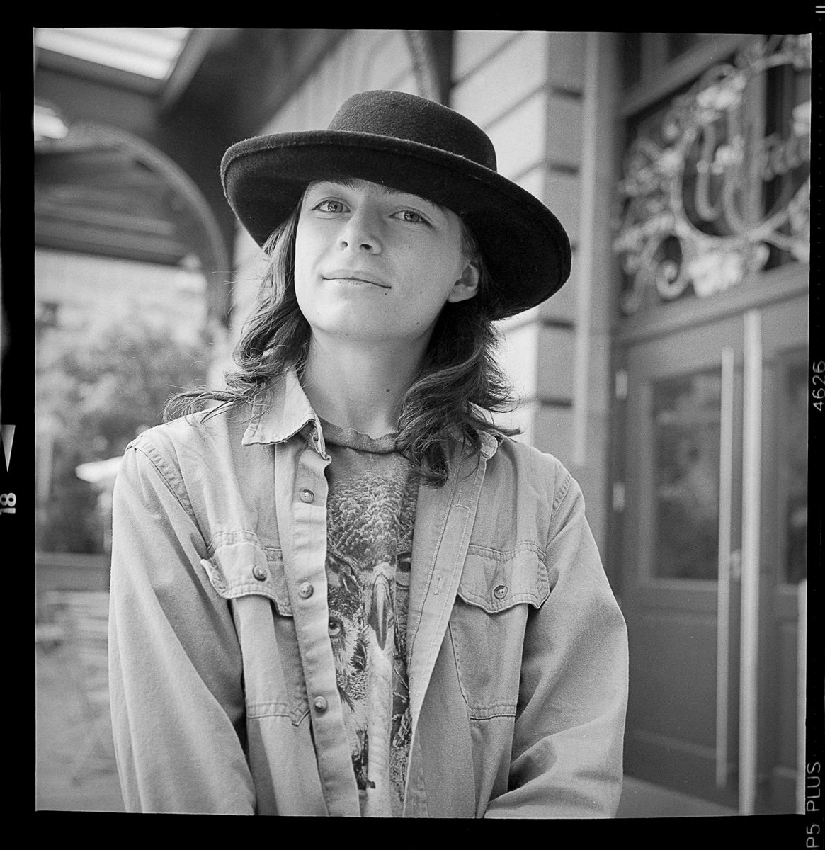 Kenneth Wadja. Black and white portrait of a woman wearing a cowboy hat.