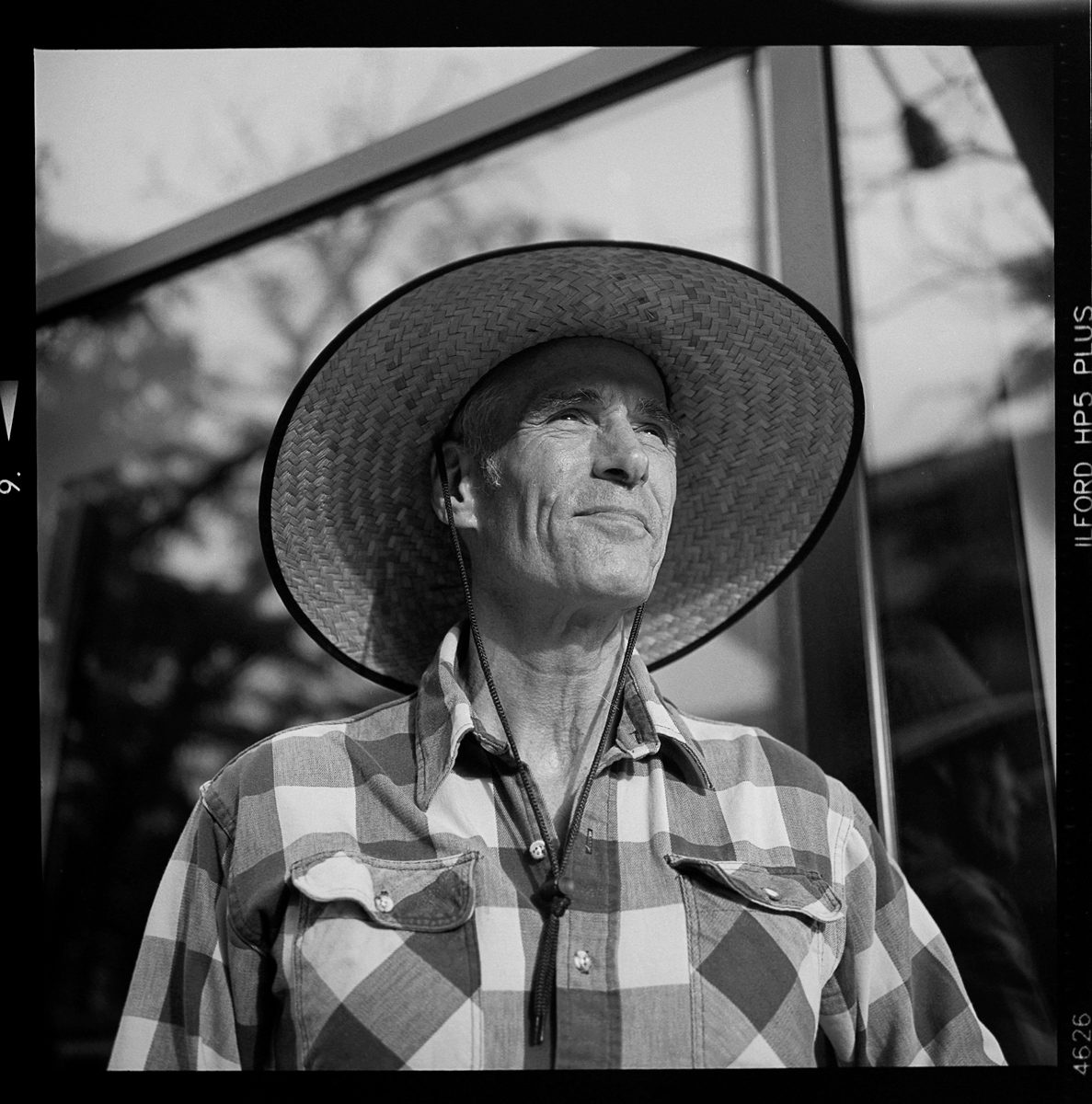 Kenneth Wadja. Black and white portrait of an elderly man looking into the distance.